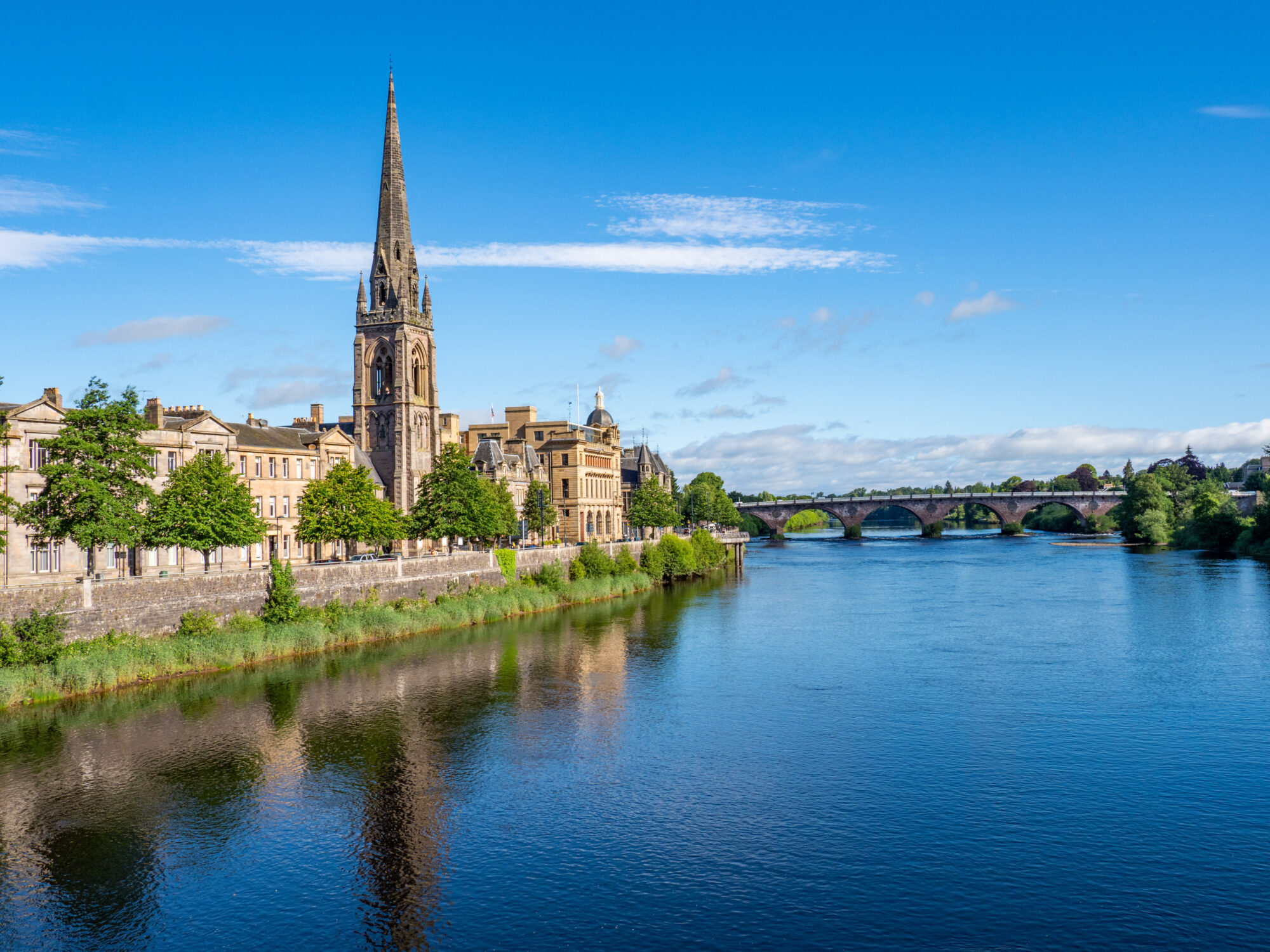 Perth City Centre and River Tay with St Matthews Church reflecting in the River Tay, Scotland