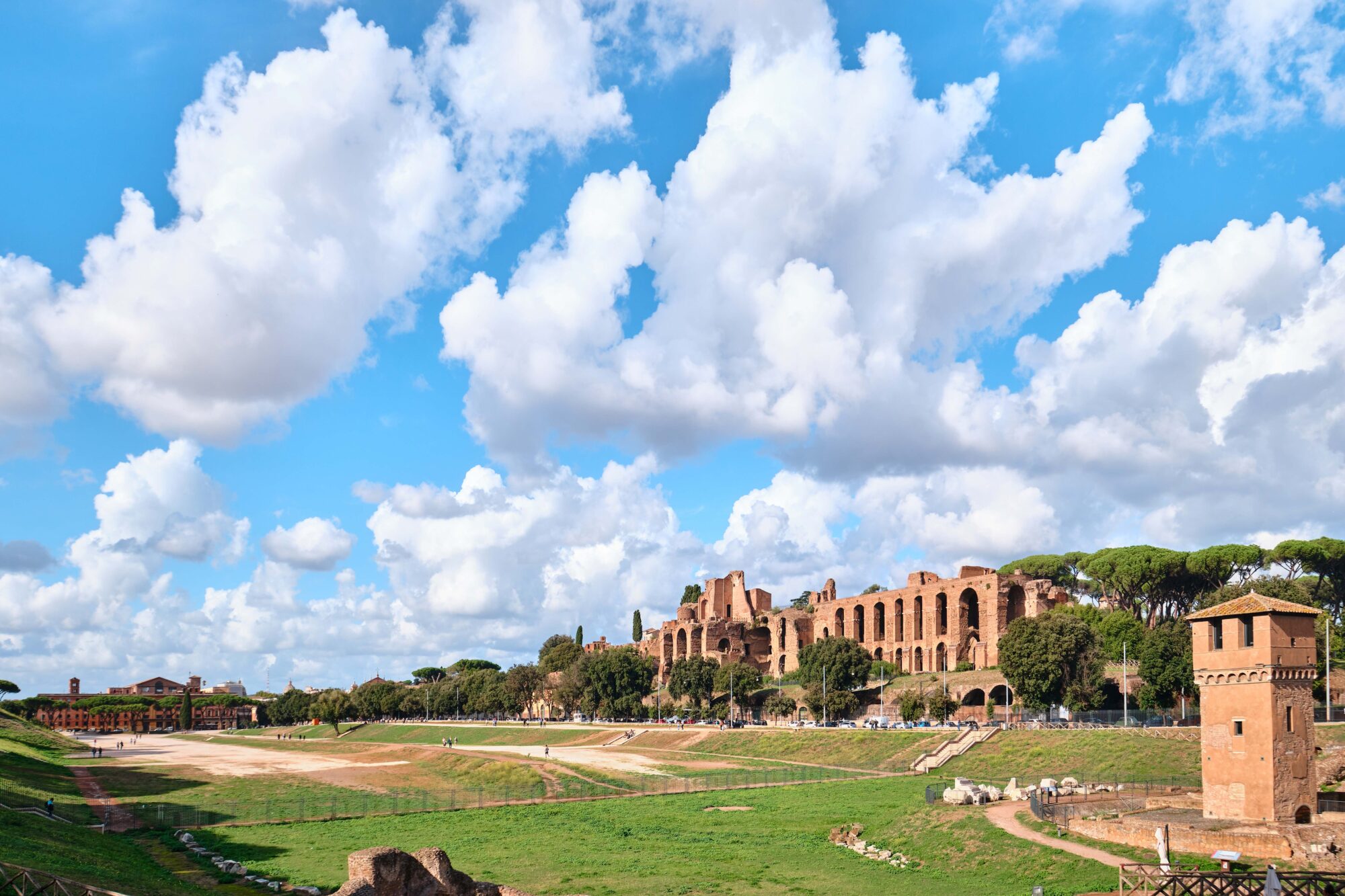 View of the Palatine Hill, centre of Roman Empire in Ancient Rome from across the Circus Maximus a large Roman stadium, Rome, Italy View of the Palatine Hill, centre of Roman Empire in Ancient Rome from across the Circus Maximus a large Roman stadium, Rome, Italy
