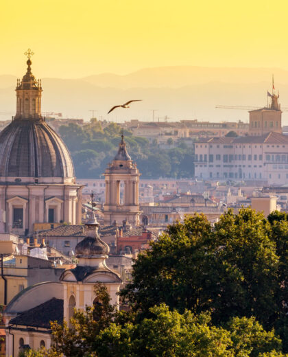 Cityscape view of historic center of Rome, Italy from the Gianicolo hill during summer sunny day sunset
