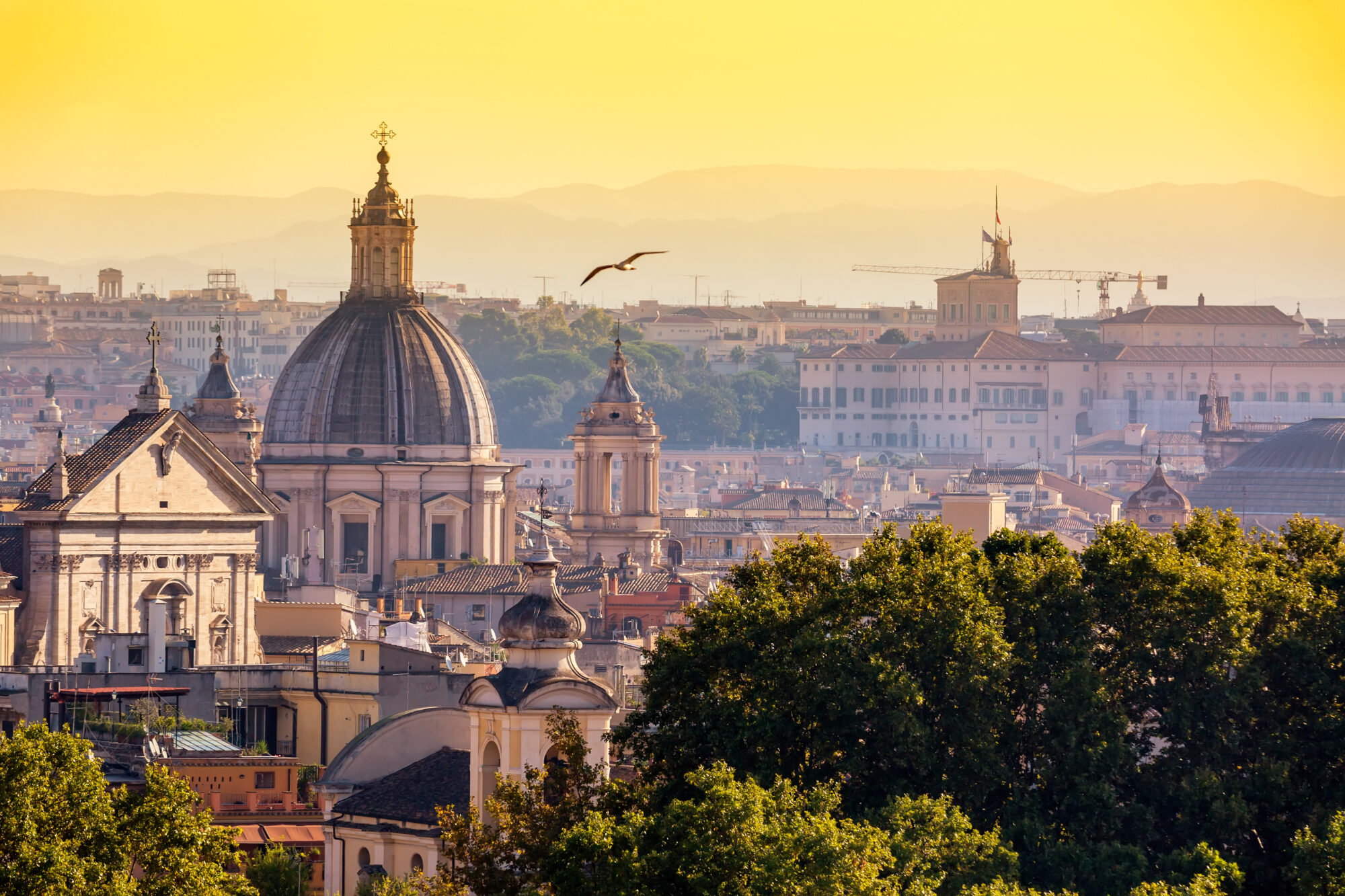 Cityscape view of historic center of Rome, Italy from the Gianicolo hill during summer sunny day sunset Cityscape view of historic center of Rome, Italy from the Gianicolo hill during summer sunny day sunset