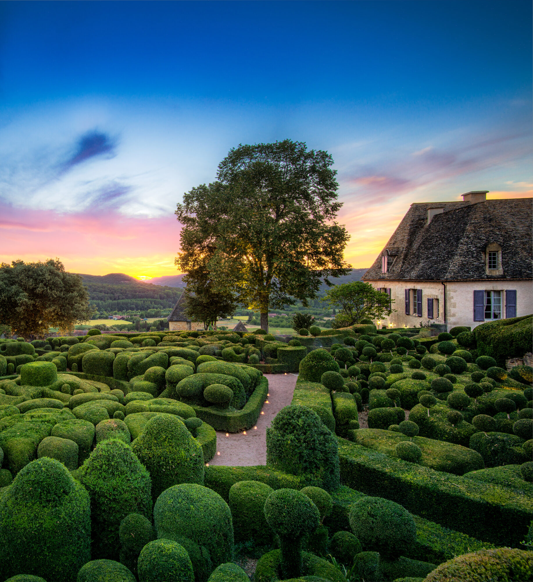 Marqueyssac gardens showcase beautiful landscaping at sunset in France Marqueyssac gardens showcase beautiful landscaping at sunset in France