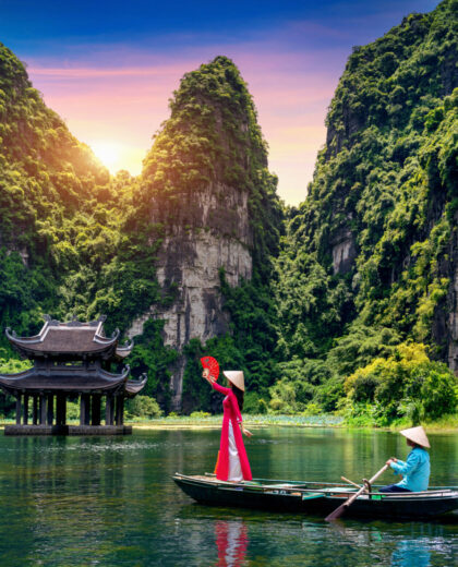 Asian woman wearing Vietnam culture traditional at Trang An, Vie