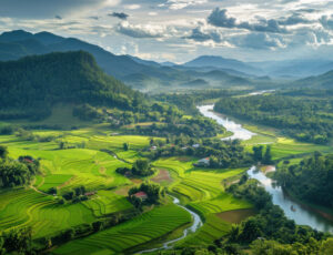 A panoramic view of the Mae Hong Son countryside, with lush green rice terraces and winding rivers