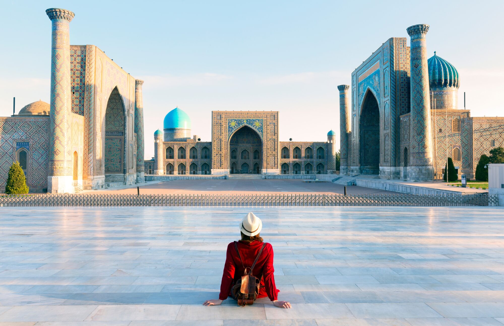 Tourist,Woman,With,Hat,And,Dress,Red,Sitting,On,Registan, Tourist,Woman,With,Hat,And,Dress,Red,Sitting,On,Registan,