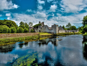 The Desmond Castle in Adare beautifull Village, on the banks of the Maigue River, in Ireland, Co. Limerick. HDR Landscape